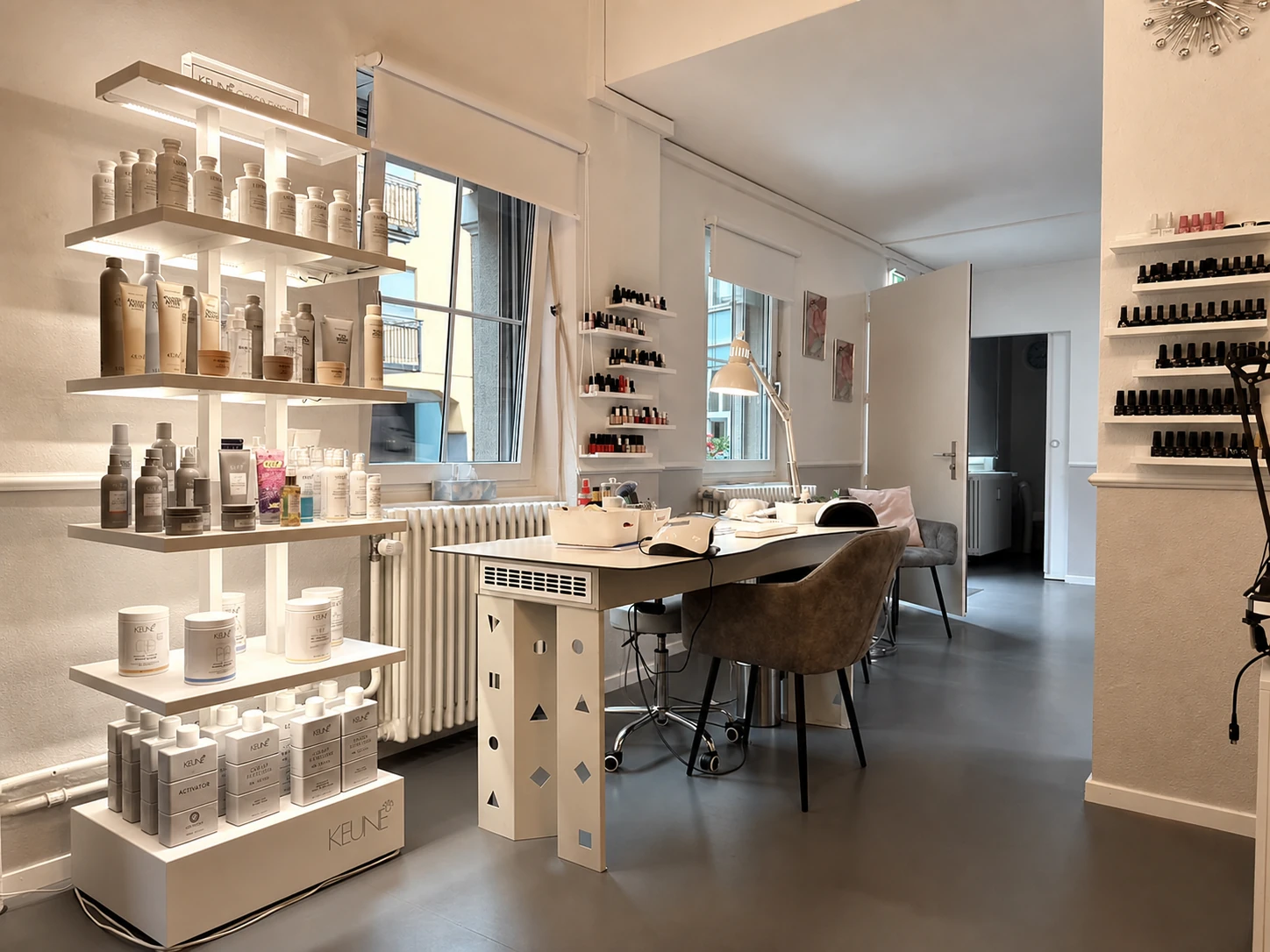 Manicure desk and illuminated product shelves