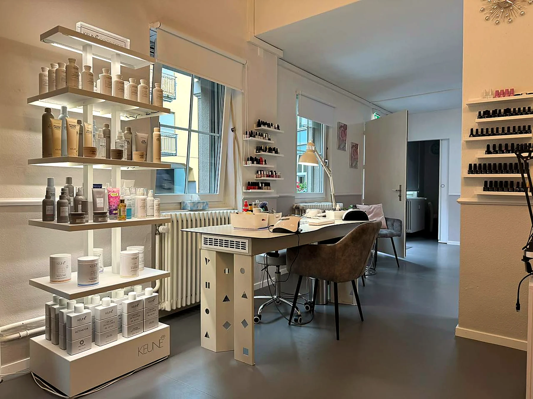 Manicure desk and illuminated product shelves
